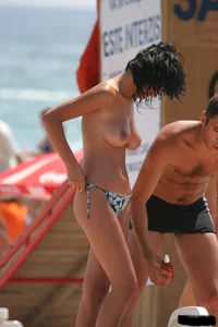 Beach voyeur girls in bikinis, thongs and topless