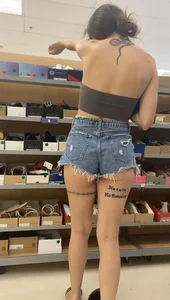 Slim Latina ass peeking out of shorts