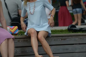 Blonde milf upskirted showing white panties and some pubes