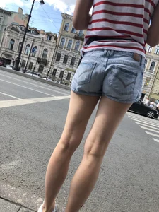 Cute Girl with Hot Long Skinny Legs in Blue Denim Shorts Street Closeup Photos