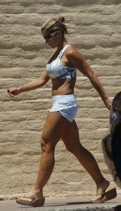 Fit babe in white shorts with big boobs in athletic top