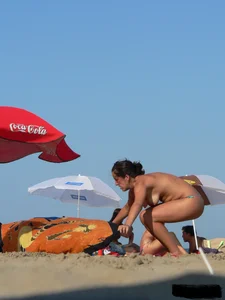 2 topless thonged sexy friends on the beach with great bodies