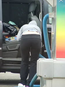 Girls cleaning their cars in jeans and pants