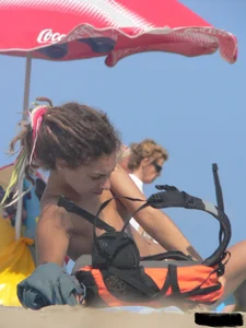 Sexy girls going topless at the beach showing off their sexy bodies