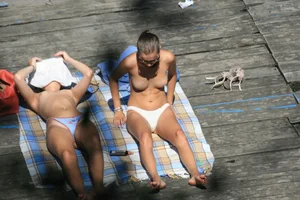Two teens stripping and going topless to tan