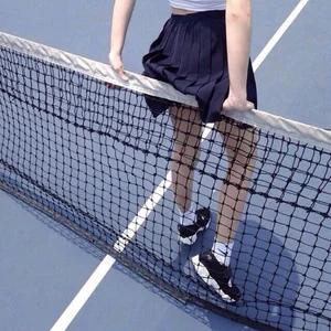 Skinny Girl in a Skirt at the Tennis Court