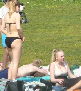 Teen taking off her dress in the park