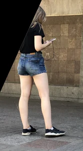 Cute Girl Distributing Leaflets in Shorts City Candid Gallery