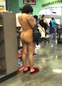 Latina with hard nipples and a big booty in tight spandex shorts outfit