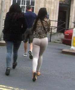Brunette lady with a nice ass in light grey leggings walking