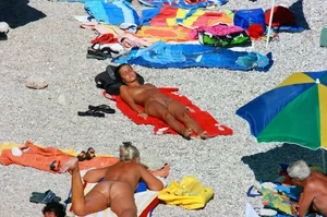 Ula FKK Sexy brunette on a nude beach topless, bottomless and with blue thong