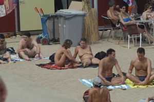 Topless girls on a beach in Barcelona