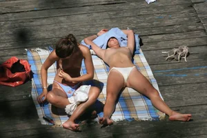 Two teens stripping and going topless to tan