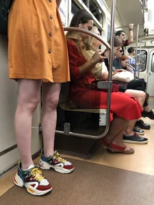 Cute Teen Girl in a Dress With Slim Legs Standing in the Subway Train, Then Crossing the Street Photo Gallery