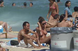 Topless girls on a beach in Barcelona