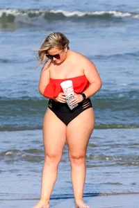 Thick BBW blonde lady in a bikini at the beach