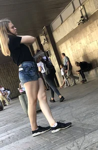 Cute Girl Distributing Leaflets in Shorts City Candid Gallery