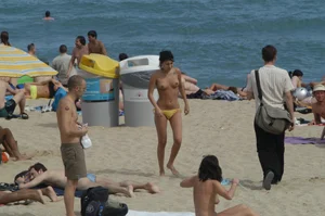 Topless girls on a beach in Barcelona