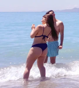 Thick lady at the beach in little blue bikini with big ass