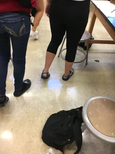 Stocky College Girl in Short Leggings And Sandals Classroom Photo