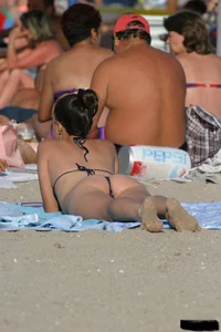 Beach voyeur girls in bikinis, thongs and topless