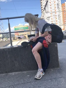 Blonde Girl Busy with Her Smartphone on the Street Candid Gallery