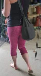 Milf shopping with a nice ass in tight maroon leggings