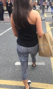 Sexy girl walking in grey patterned leggings with friend in tight jeans