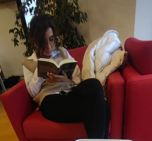 Candid Girl in Tights Sitting With Crossed Legs While Reading a Book Creepshot
