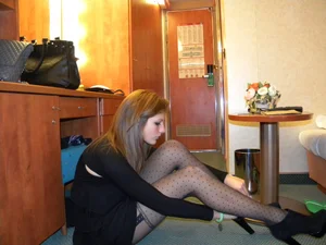 Girl in Dotted Pantyhose Sitting on the Floor in a Hotel Room Creepshot