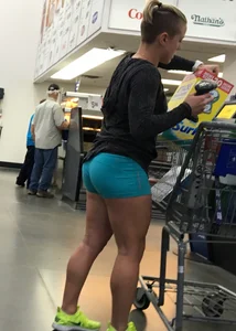Big booty girl in blue spandex shorts shopping