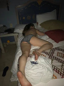 Candind girls, naked or in panties, laying in bed
