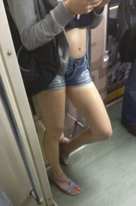 Teen in a Top, Mini-Shorts and Sandals in a Subway Train Candid