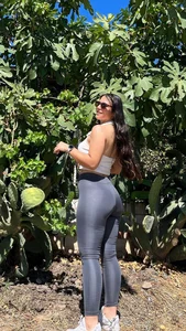 Stocky non-candid girl wearing leggings, photos in a garden