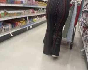 White girl in flare pants bending over