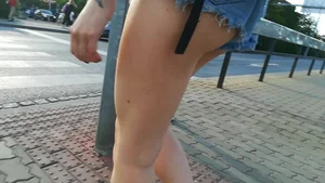 Girl walking in denim shorts showing some of her ass cheeks