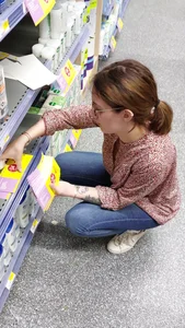 Brunette girl with nice ass sexy PAWG in tight jeans in a store