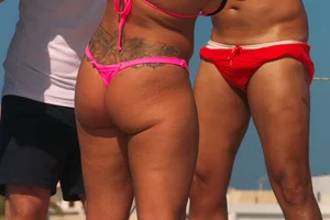 Big booty blonde babes on the beach in little thong bikinis