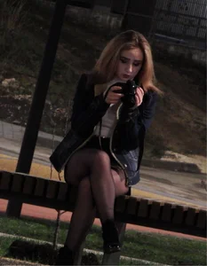 Hot Girl with Hot Legs in Black Pantyhose Sitting on the Bus Stop