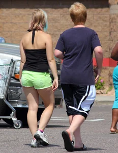 Blonde girl in glasses with a thick booty in green shorts