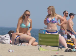 3 girls on the beach in bikinis with big boobs, one brunette and two blondes