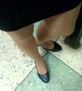 Legs in Pantyhose Closeup And Feet in Flats College Closeup