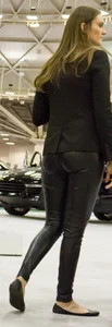 Pretty car saleswoman in tight shiny black pants with nice ass