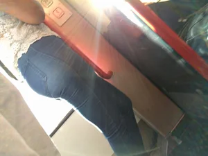 Train girl in tight jeans with a nice ass standing around