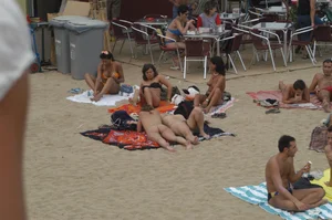 Topless girls on a beach in Barcelona