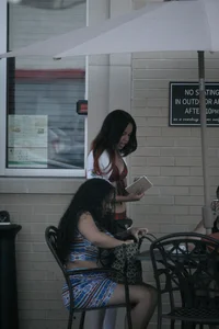 Two sexy Tilted Kilt employees showing cleavage and cheeks