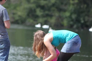 Candid Girl in a Denim Skirl And Black Pantyhose Bending Over by the Lake Creepshot