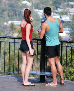 Redhead beauty in short shorts showing some cheeks and panties