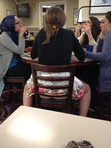 Girl in a Skirt Sitting with Spread Legs Creepshot