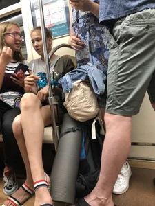 Tall Candid Teen Girl in Denim Shorts And Sandals Sitting in the Subway Train, Then Walking Down the Station